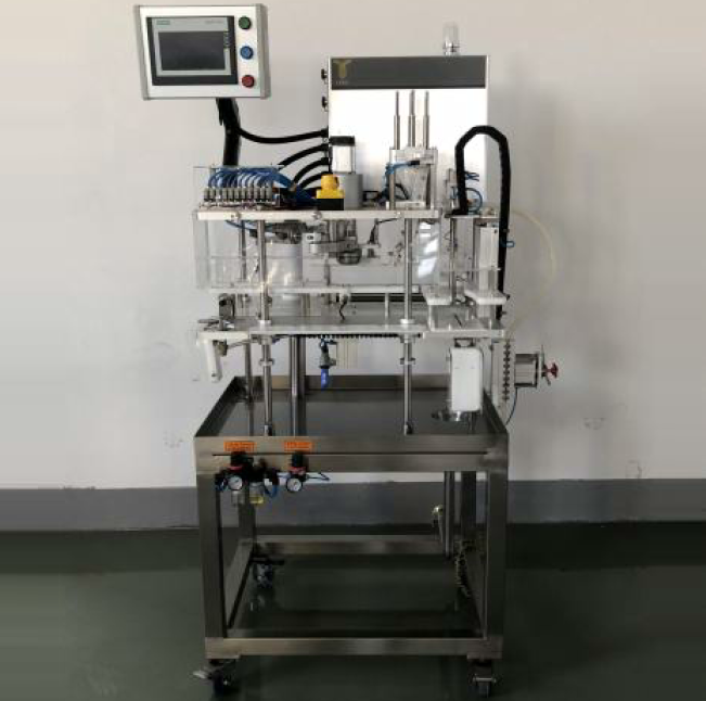 Automated canning machine with a touchscreen control panel and several tubes and valves.
