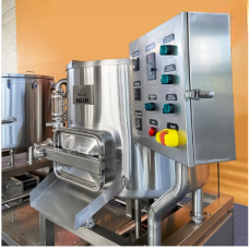 Stainless steel mixing machine with control panel and various buttons.