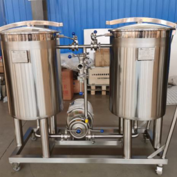 Stainless steel CIP System with two tanks and connected piping.
