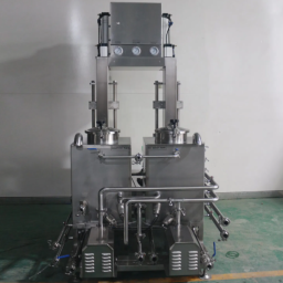 Stainless steel processing machine with control panel and various connected tubes.