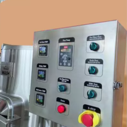 Control panel with buttons and a digital screen for operating machinery.