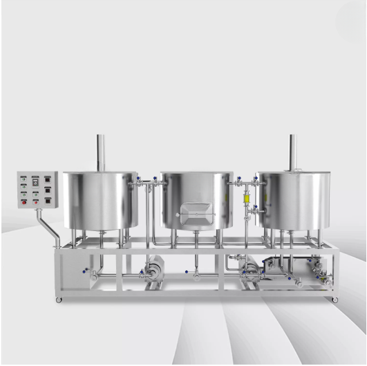 Industrial brewing system with three stainless steel vessels on a metal frame.