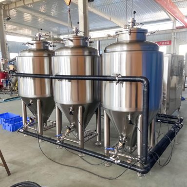 Image of fermenter vessels with glycol cooling pipework servicing the dimple jackets.