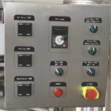 Control panel with buttons and a dial for machine operation.