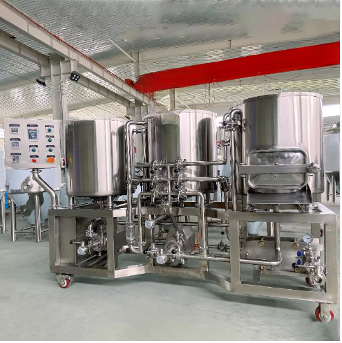 Stainless steel industrial equipment with tanks and piping in a factory setting.