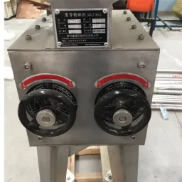 Grain Mill with two black handles and a nameplate displaying data.