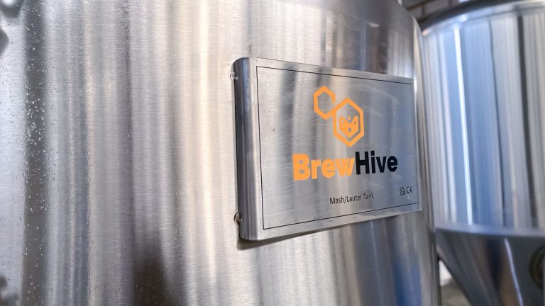 Image of BrewHive Logo on side of tank.